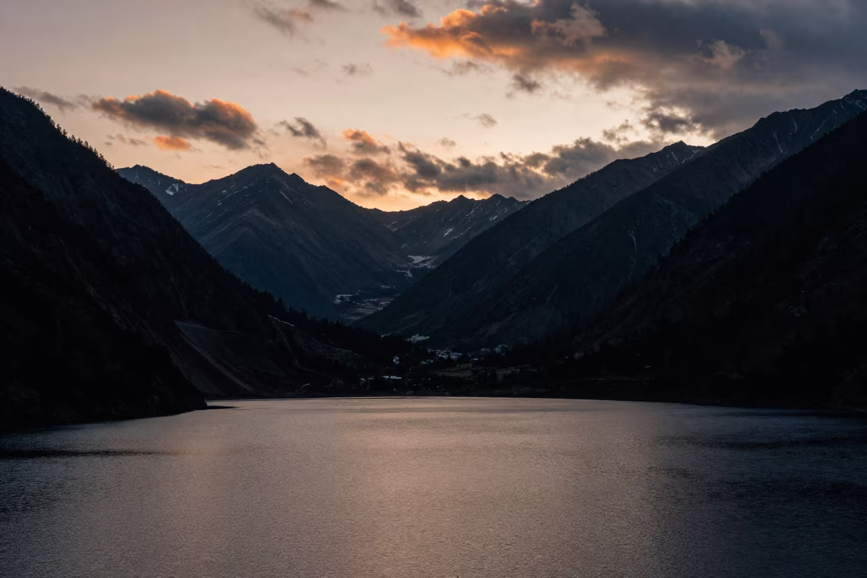 Twilight Rim Light Over Himalayan Lake in across a wide valley floor in the Himalayas