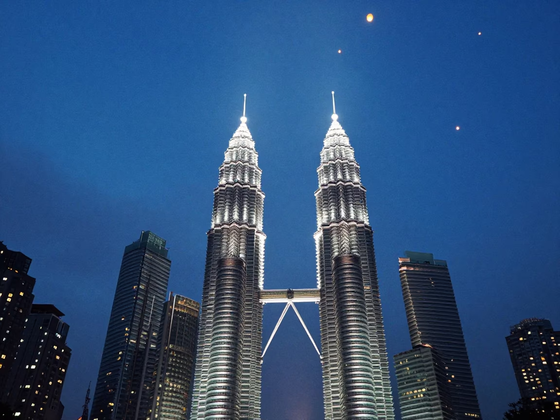 Twilight Sky Lanterns Rising Above Kuala Lumpur Petronas Towers and City Skyline in in Kuala Lumpur, Malaysia