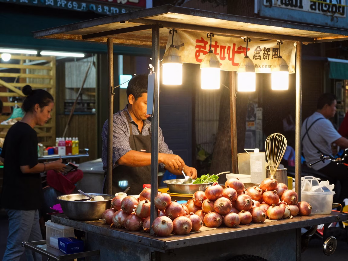 Twilight Street Food Stall in Hanoi Vietnam with Onions and Whisk in in Hanoi, Vietnam
