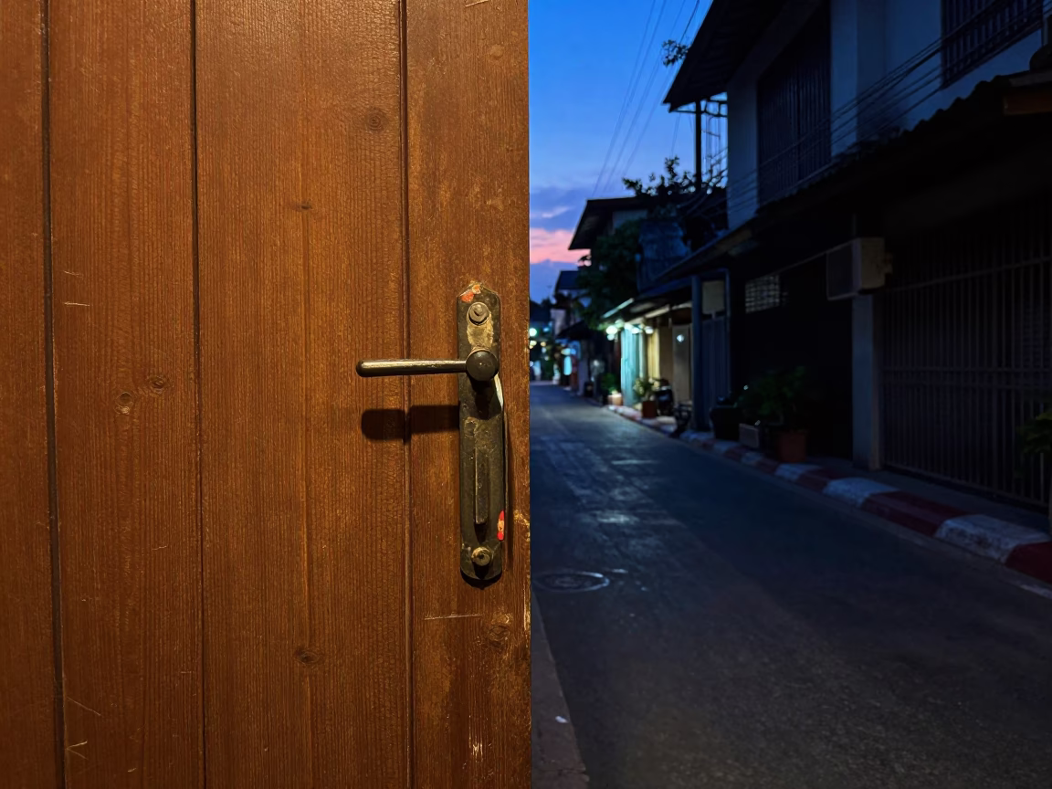 Twilight Street Scene in Bangkok Thailand with Gate Handle and Paint Flecks in in Bangkok, Thailand