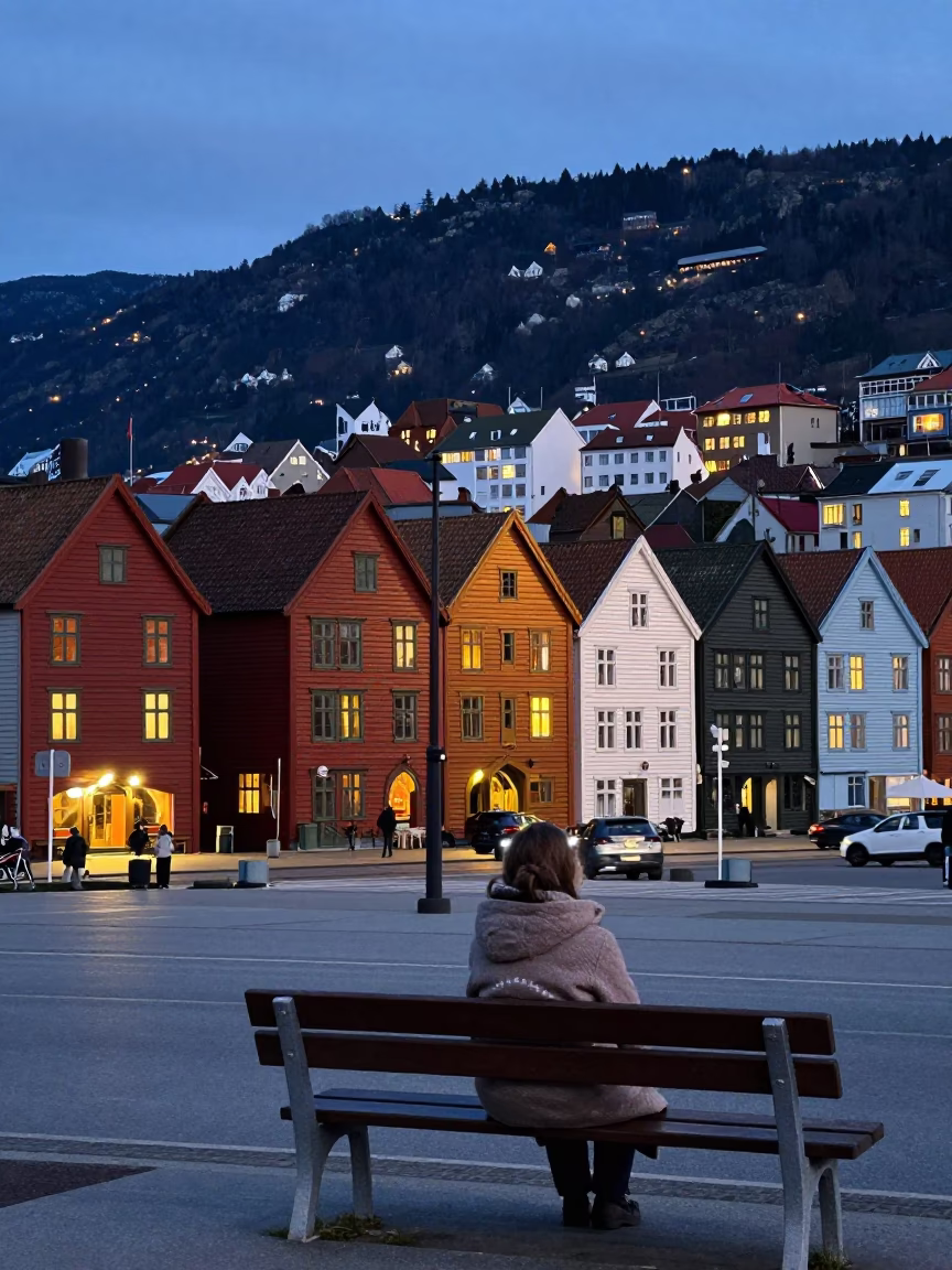 Twilight Street Scene in Bergen Norway with Colorful Hanekrabben Houses and Lantern Light in in Bergen, Norway