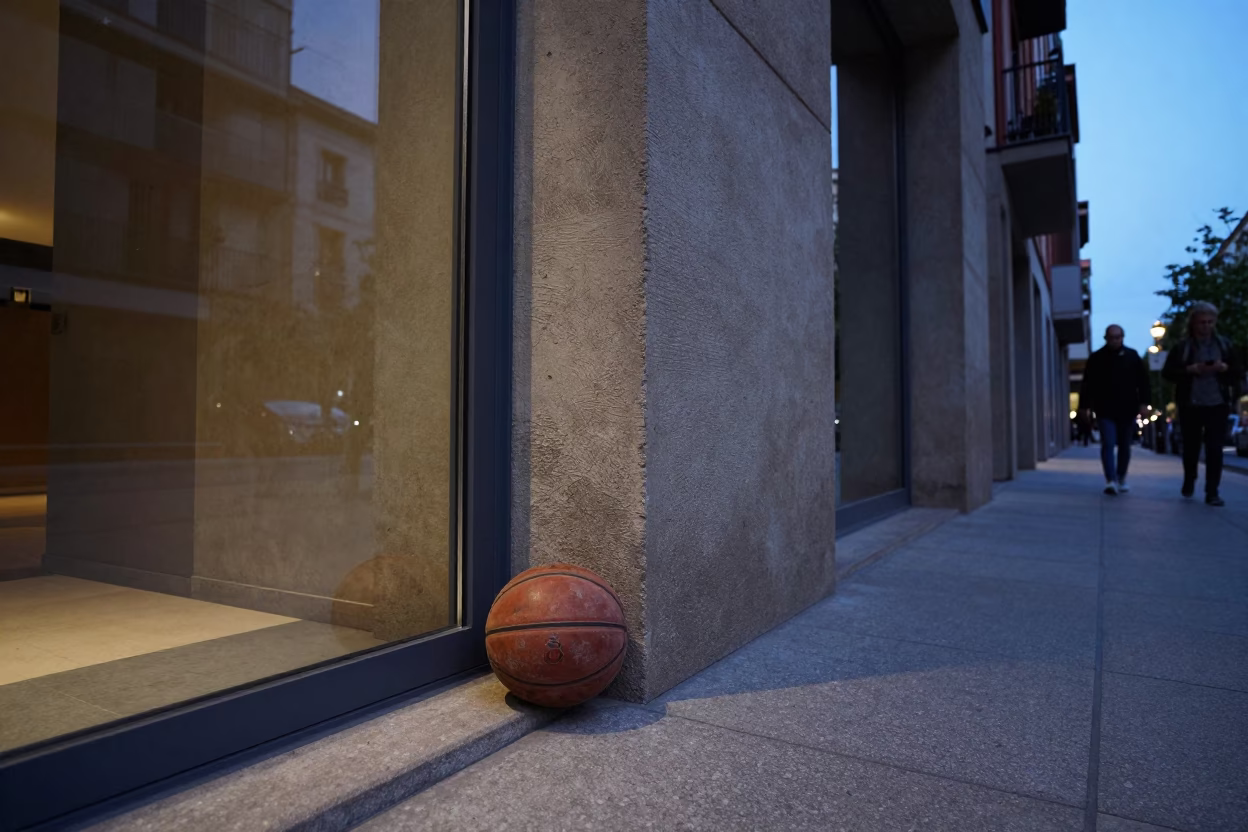 Twilight Street Scene in Bilbao Spain with Clear Glass Doorframe and Leather Basketball in in Bilbao, Spain