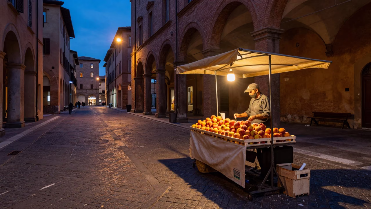 Twilight street scene in Bologna Italy with nectarines and mug on market stall in in Bologna, Italy