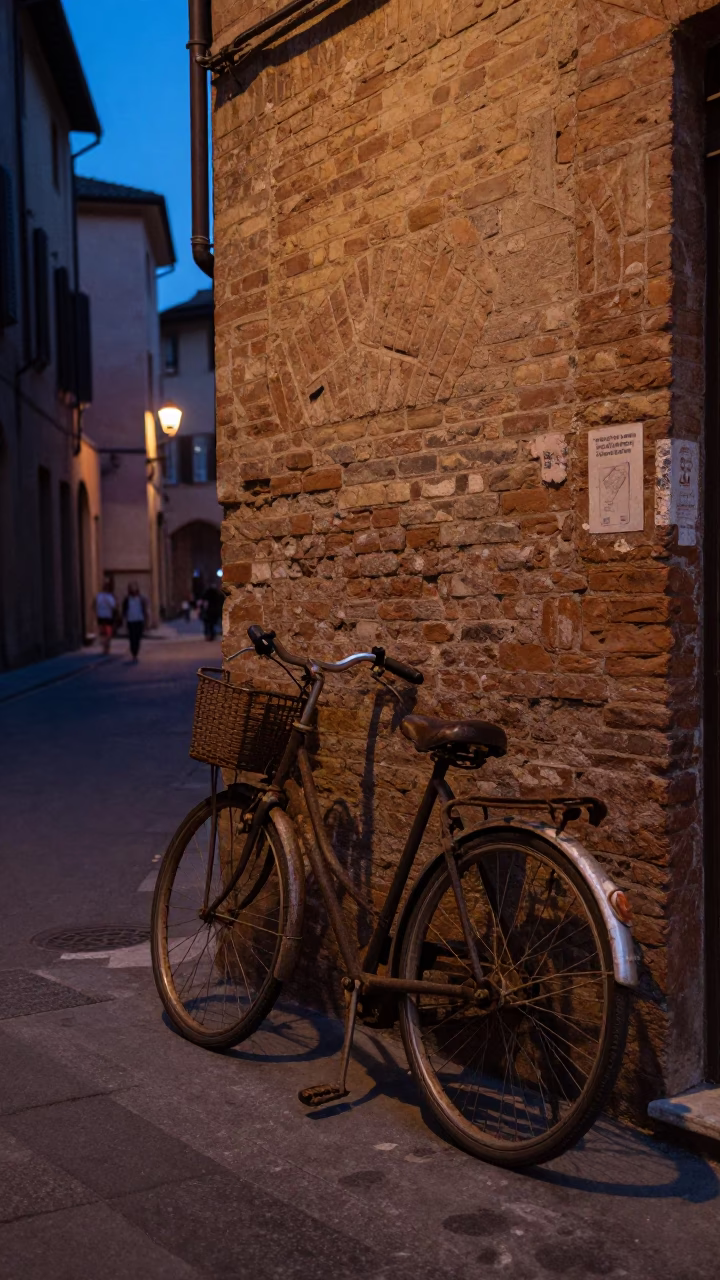 Twilight street scene in Bologna Italy with vintage bicycle and rusted drain in in Bologna, Italy