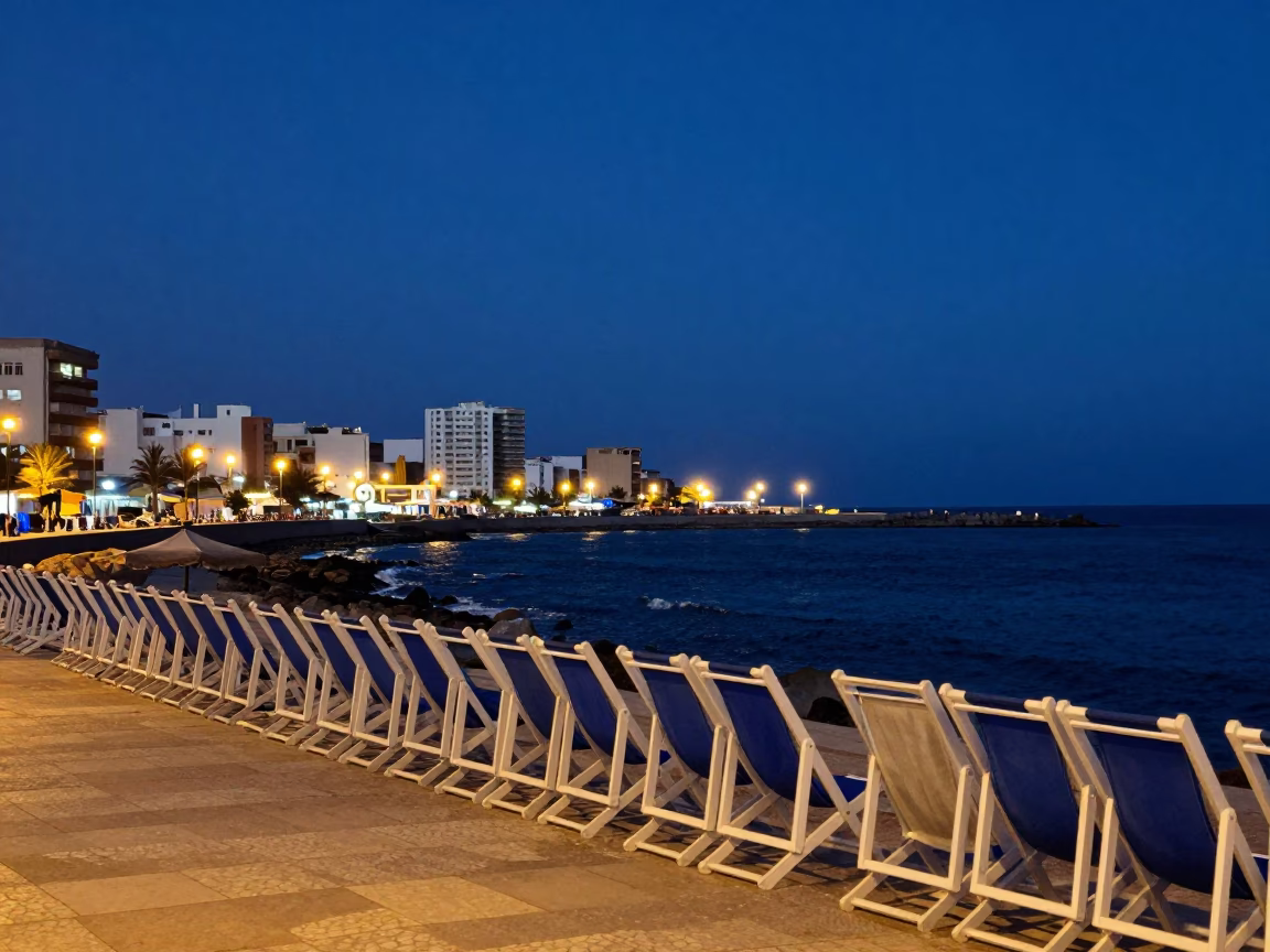 Twilight street scene in Casablanca Morocco with deck chairs and urban architecture in in Casablanca, Morocco