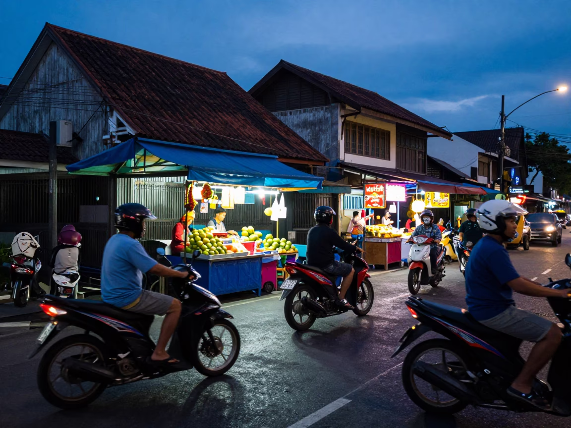 Twilight Street Scene in Denpasar Indonesia with Motorbikes and Local Shops in in Denpasar, Indonesia