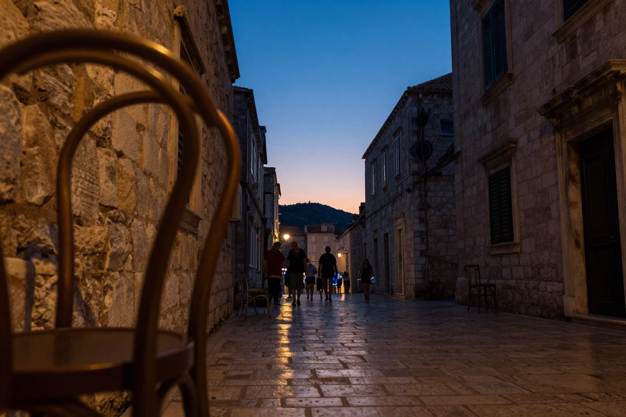 Twilight Street Scene in Dubrovnik Croatia with Brass Chair Rung and Basket in in Dubrovnik, Croatia