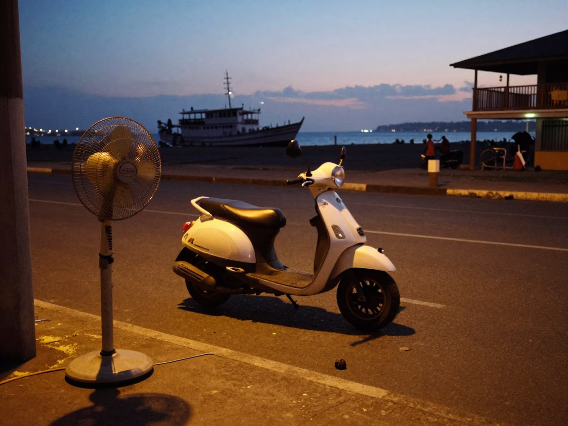 Twilight street scene in Durban South Africa with scooter and table fan in in Durban, South Africa