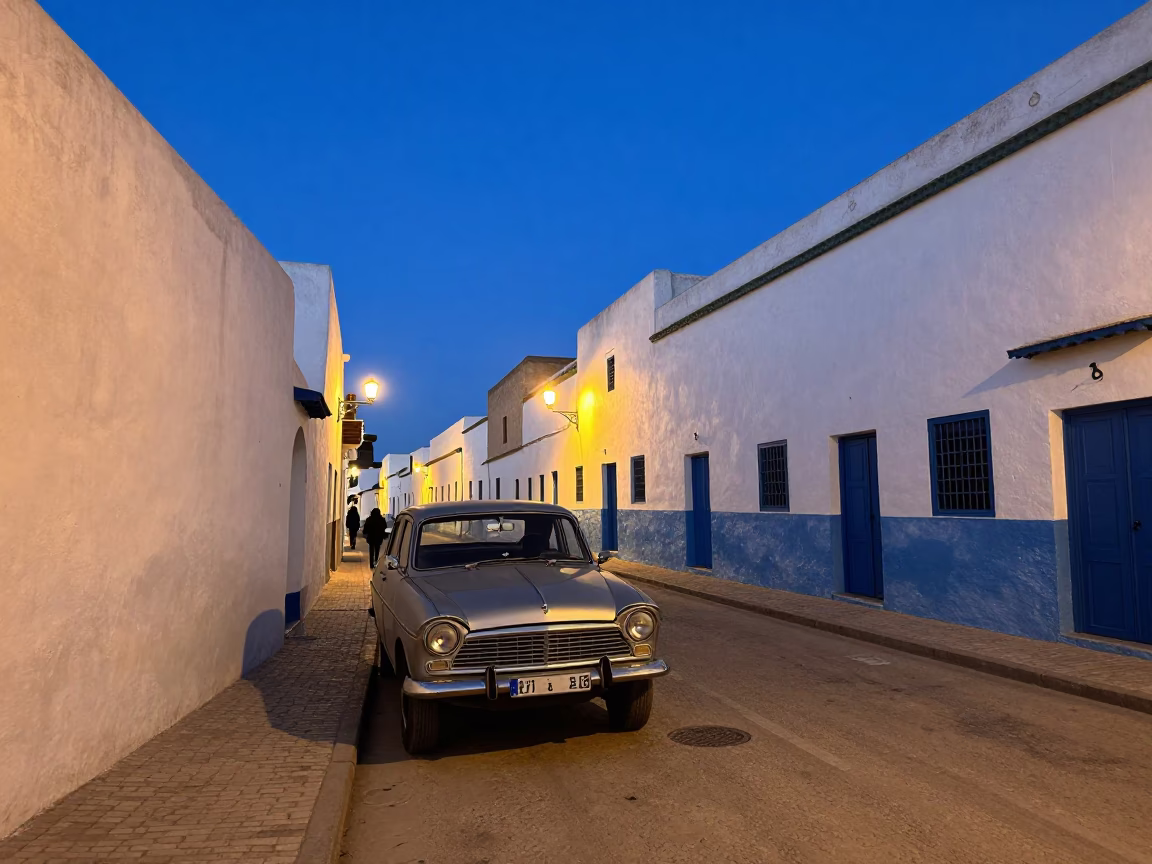 Twilight Street Scene in Essaouira Morocco with Vintage Car and Local Life in in Essaouira, Morocco