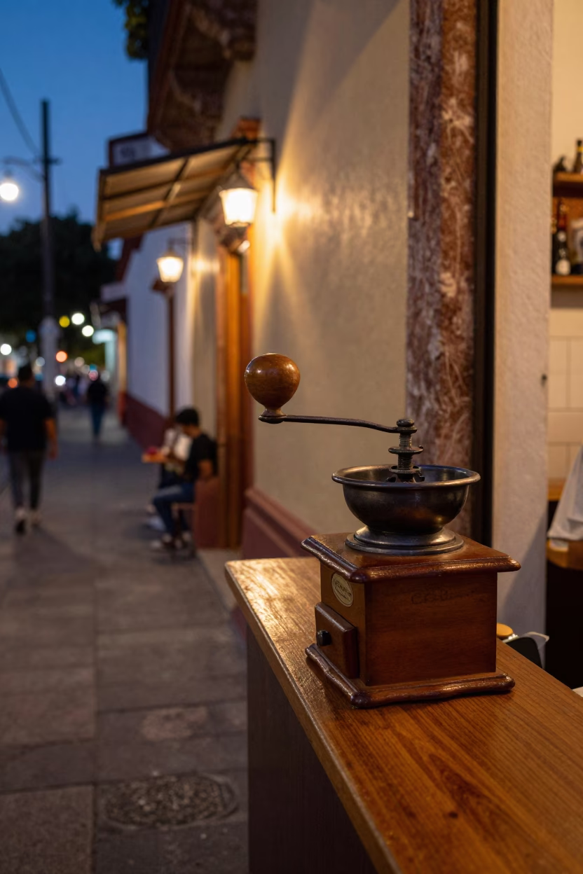 Twilight Street Scene in Guadalajara Mexico with Vintage Coffee Grinder and Window Curtains in in Guadalajara, Mexico