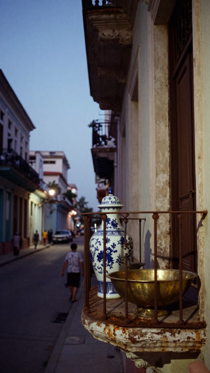 Twilight Street Scene in Havana Cuba with Porcelain Jar and Brass Basin on Balcony in in Havana, Cuba