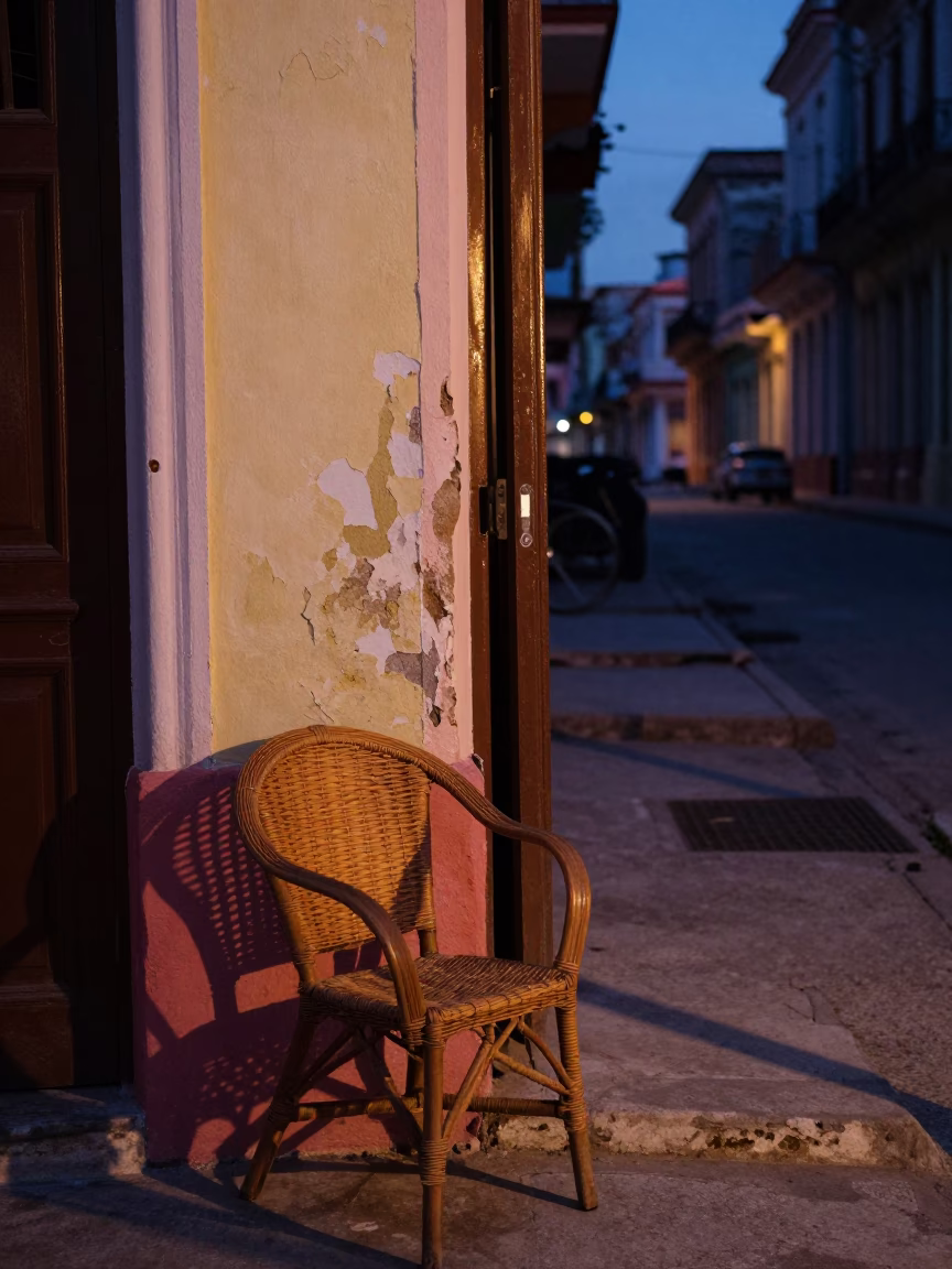 Twilight Street Scene in Havana Cuba with Wicker Chair Shadow and Dusty Tile Floor in in Havana, Cuba
