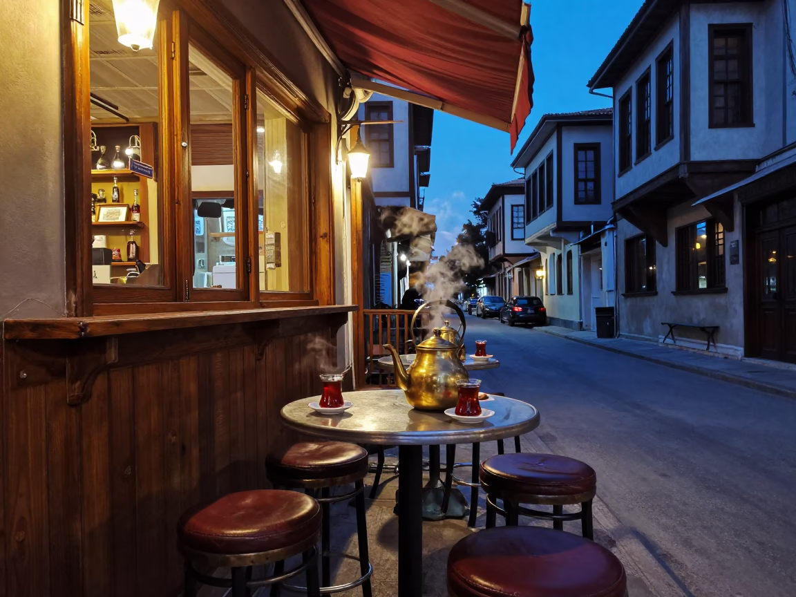 Twilight street scene in Izmir Turkey with bar stools and tea kettles in in Izmir, Turkey
