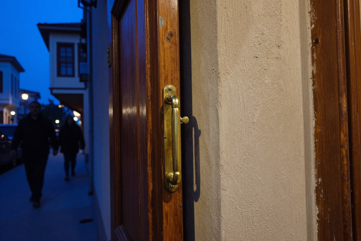Twilight Street Scene in Izmir Turkey with Polished Brass Handle and Leaf Shadows in in Izmir, Turkey