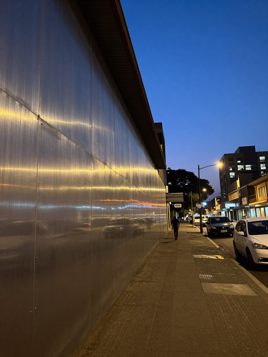 Twilight Street Scene in Johannesburg South Africa with Brushed Steel Wall and Lantern in in Johannesburg, South Africa