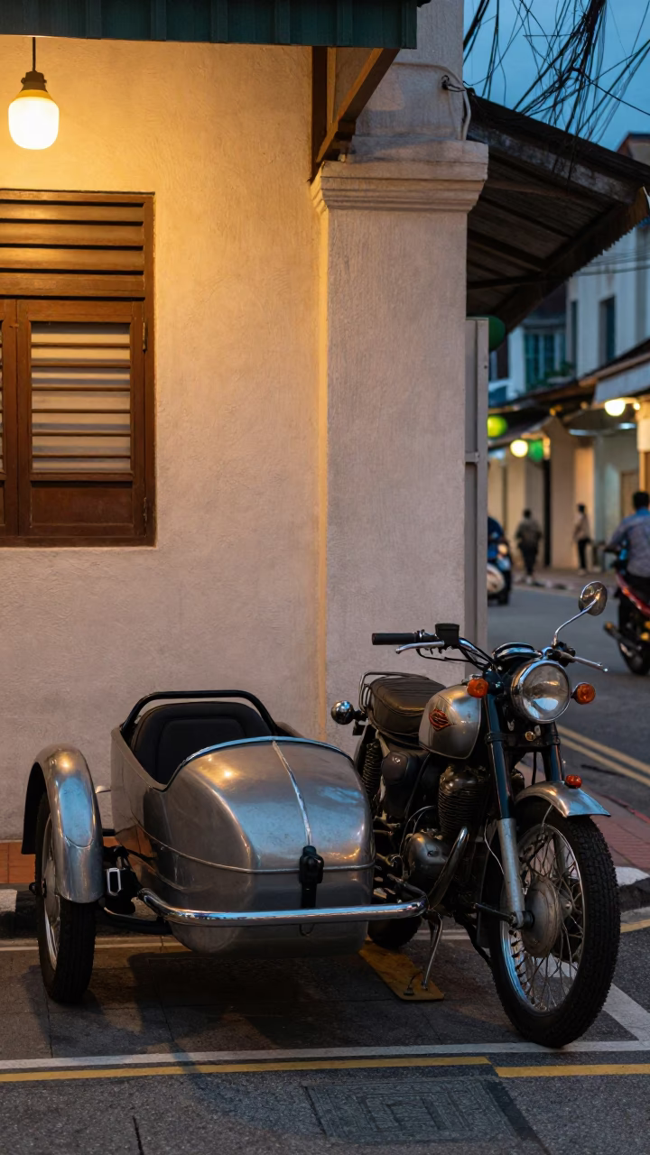 Twilight Street Scene in Kuala Lumpur Malaysia with Vintage Motorcycle and Sidecar in in Kuala Lumpur, Malaysia