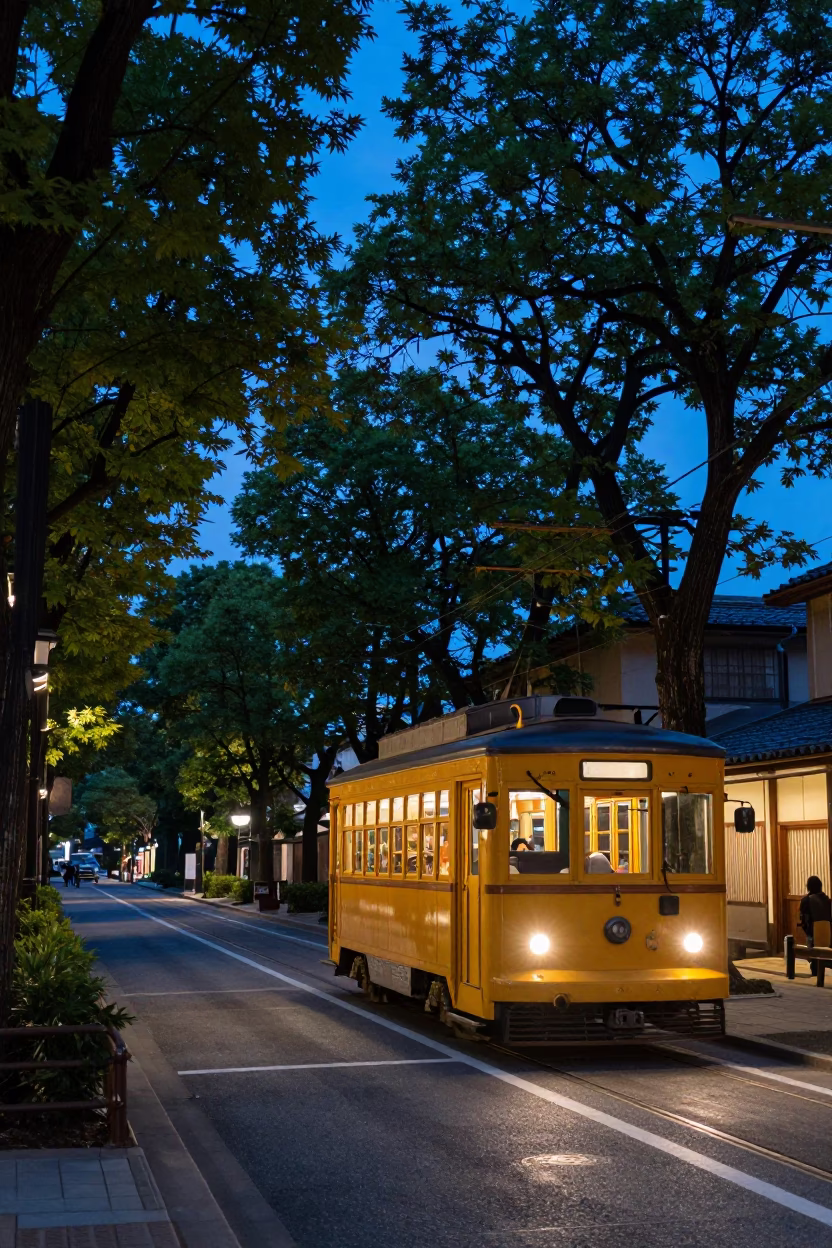 Twilight Street Scene in Kyoto Japan Featuring Vintage Trolley Car on Tree-Lined Avenue in in Kyoto, Japan