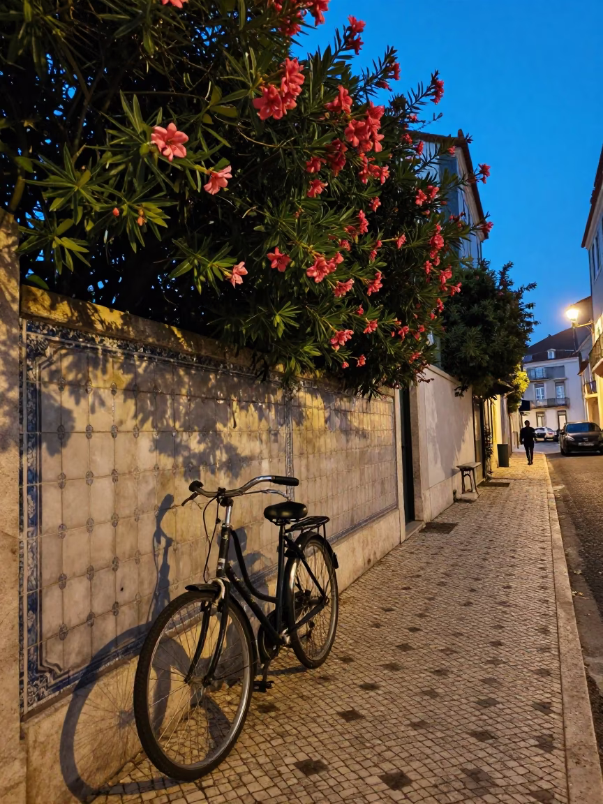 Twilight Street Scene in Lisbon Portugal with Oleander Hedge and Vintage Details in in Lisbon, Portugal
