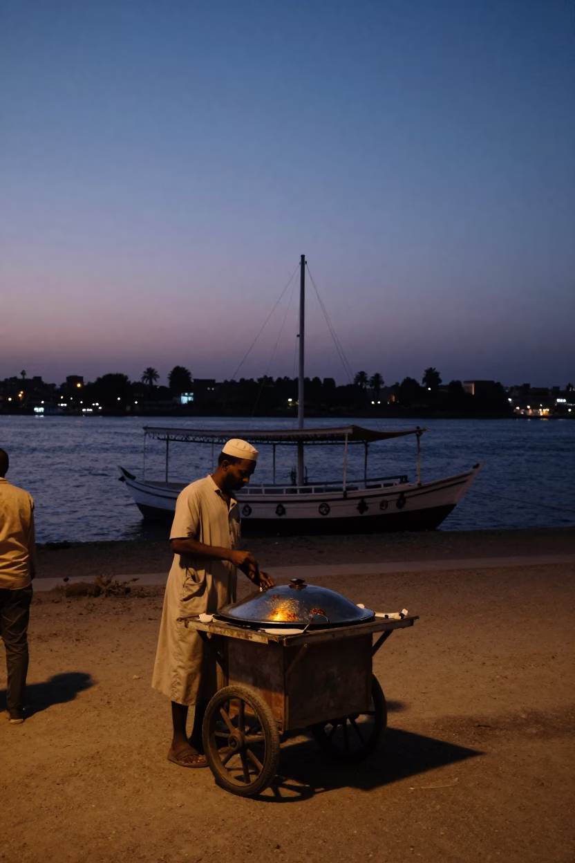 Twilight Street Scene in Luxor Egypt with Dhow Silhouette and Local Life in in Luxor, Egypt