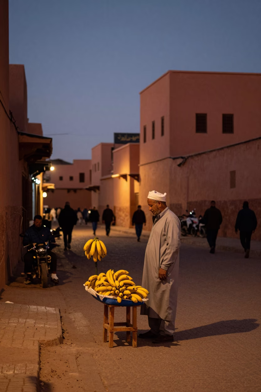 Twilight Street Scene in Marrakech Morocco with Banana Seller and Stool in in Marrakech, Morocco