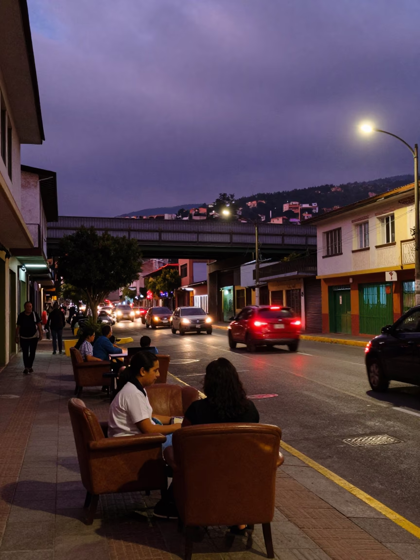 Twilight Street Scene in Medellin Colombia with Armchairs and Overpass Traffic in in Medellin, Colombia