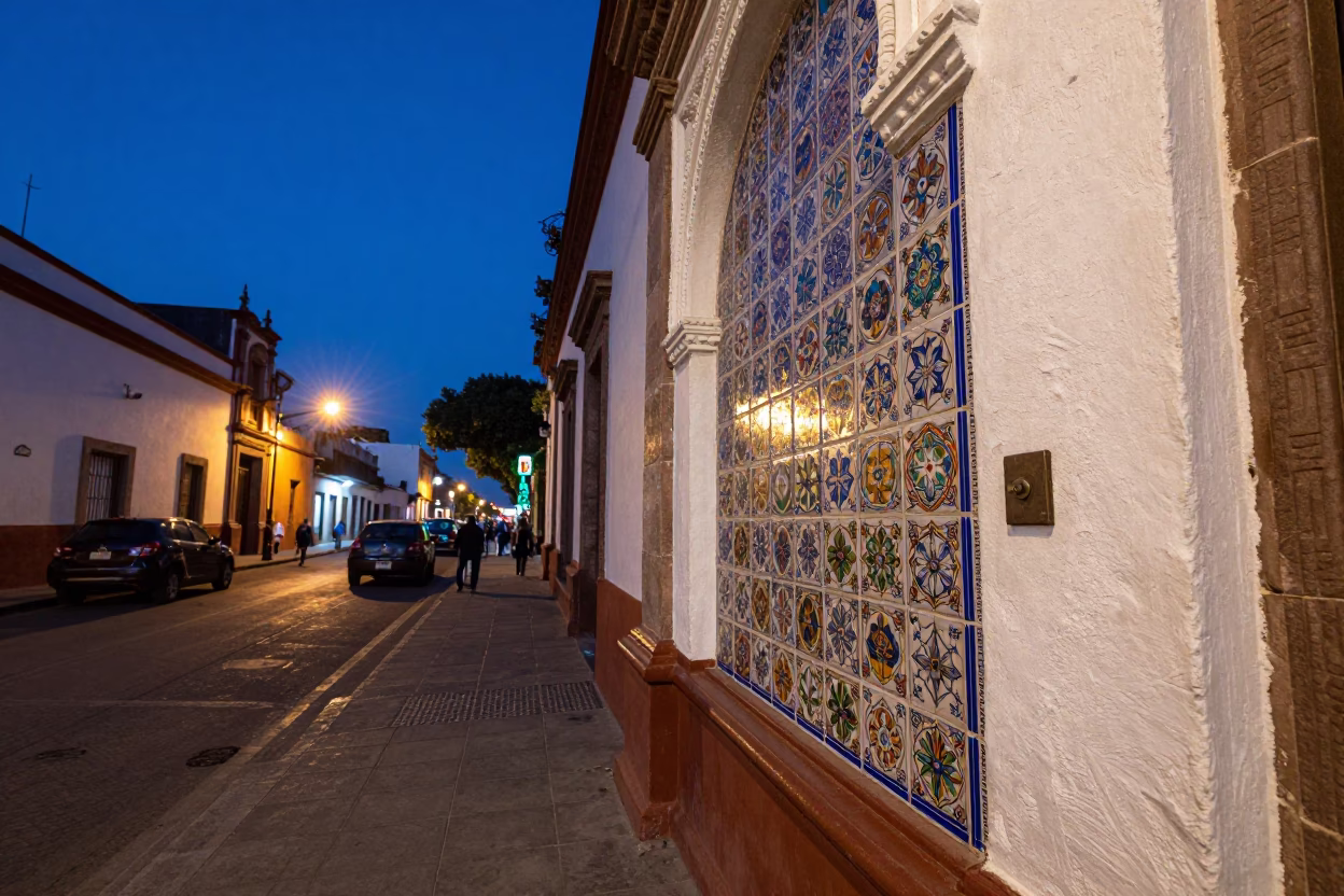 Twilight street scene in Mexico City with ceramic tiles and deadbolt on colonial doorway in in Mexico City, Mexico