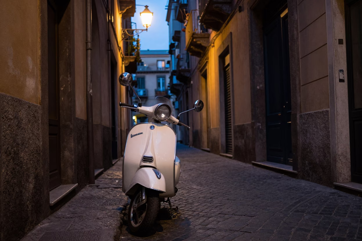 Twilight street scene in Naples Italy with vintage Vespa and hanging laundry in in Naples, Italy