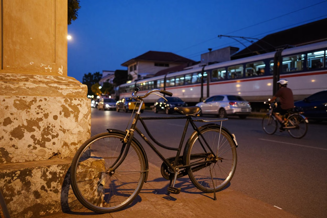 Twilight street scene in Phnom Penh Cambodia with vintage bicycle and monorail in in Phnom Penh, Cambodia
