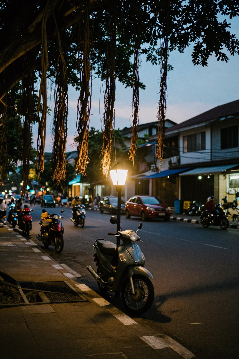 Twilight Street Scene in Surabaya Indonesia with Vintage Motorcycle Lantern and Banyan Tree in in Surabaya, Indonesia