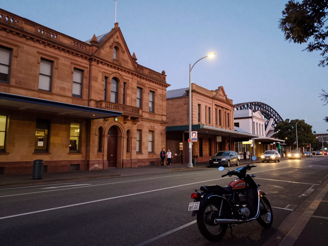 Twilight street scene in Sydney NSW Australia with vintage motorcycle and casual local interaction in in Sydney, New South Wales, Australia