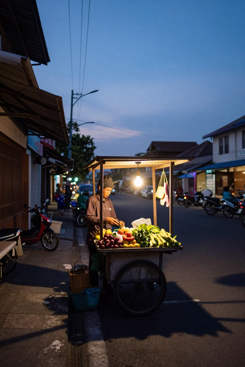 Twilight Street Scene in Yogyakarta Indonesia with Local Vendor and Hanging Baskets in in Yogyakarta, Indonesia