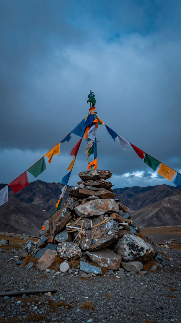 Twilight Summit Cairn Prayer Flags High Pass in along a high mountain pass beneath prayer flags near Leh