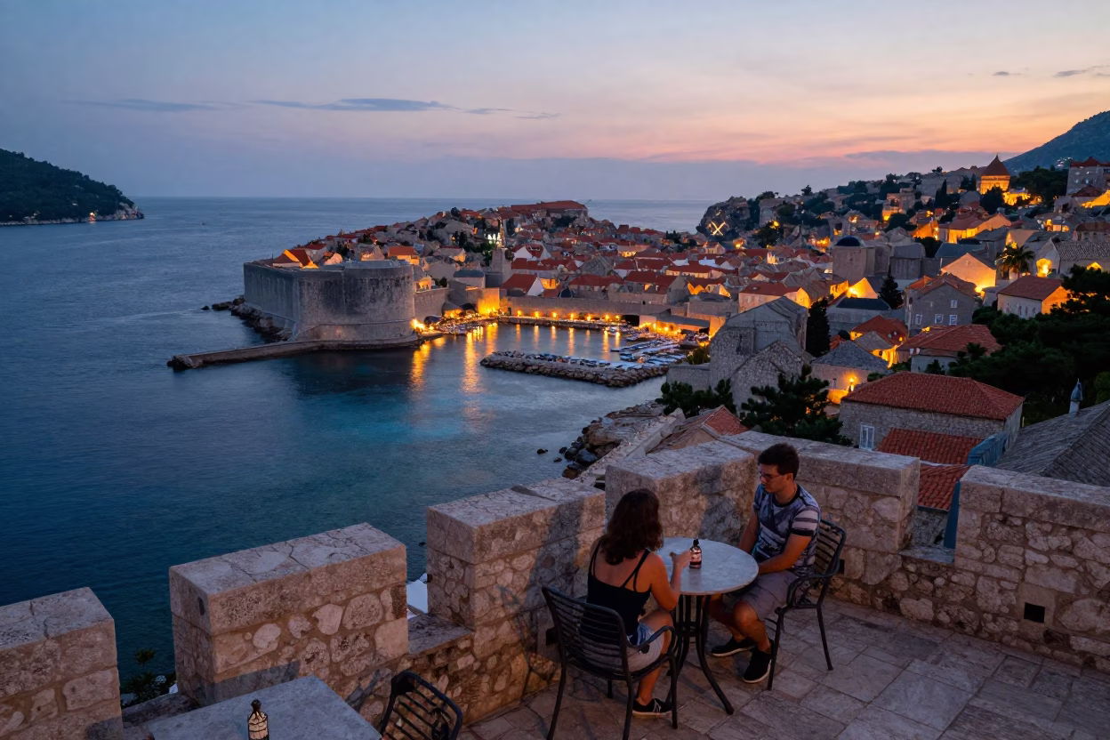 Twilight View of Dubrovnik Old Town Walls and Sea from Cafe Terrace in in Dubrovnik, Croatia