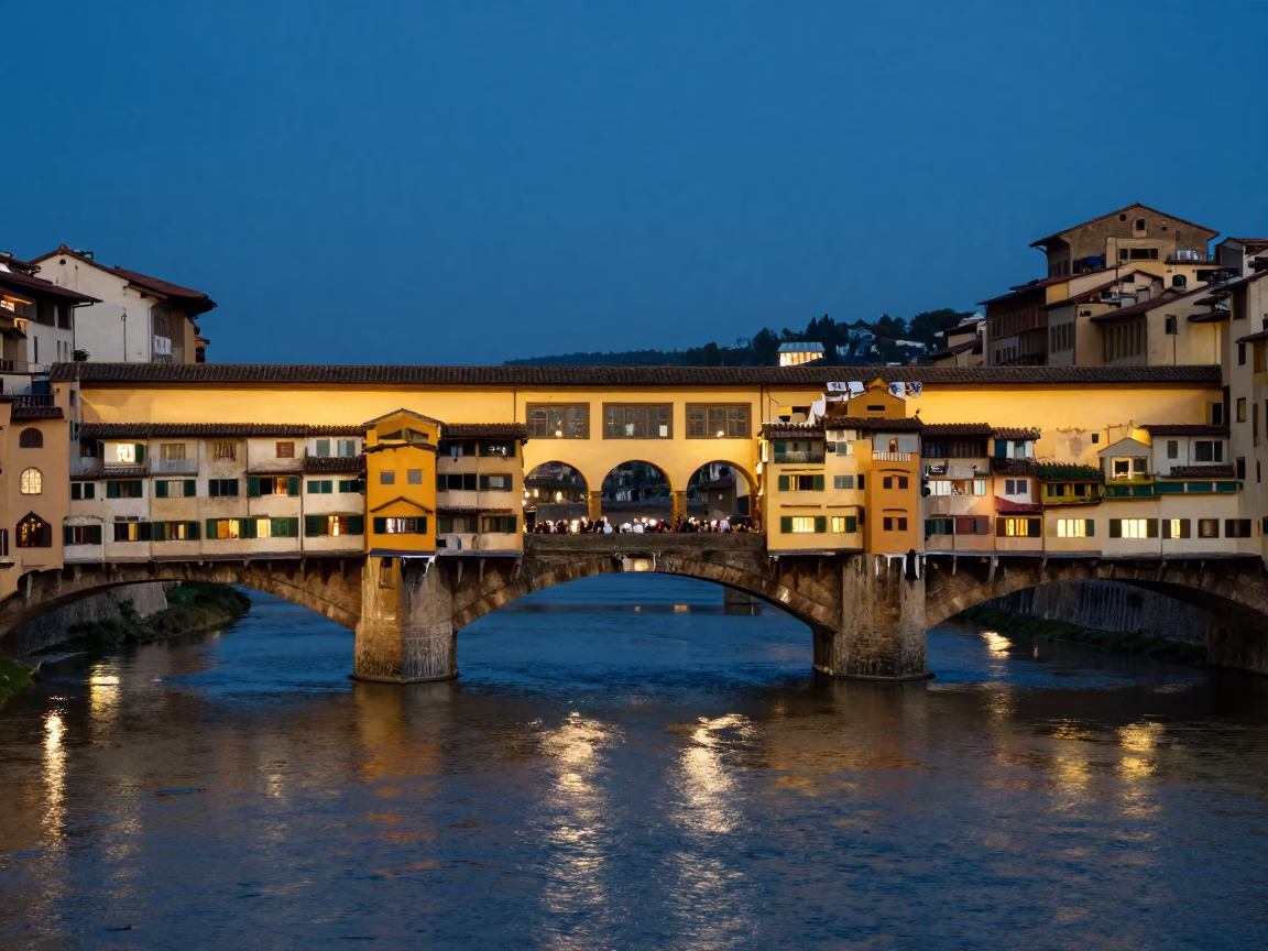 Twilight View of Florence Arno River and Ponte Vecchio Bridge with City Lights in in Florence, Italy