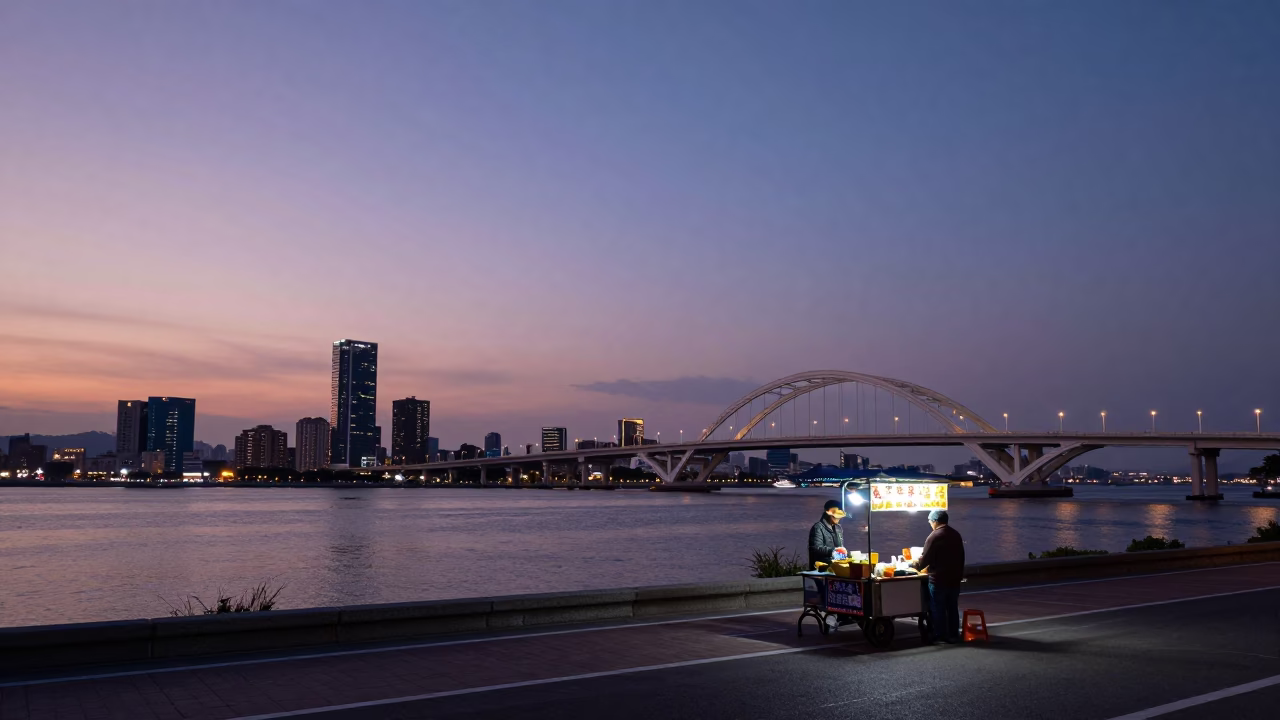 Twilight View of Kaohsiung Skyline and Formosa Bridge with Evening Street Food Vendor in in Kaohsiung, Taiwan