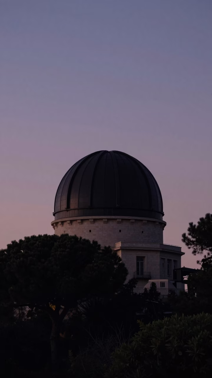 Twilight View of Marseille Observatory Dome Silhouette Against Deepening Blue Sky in in Marseille, France