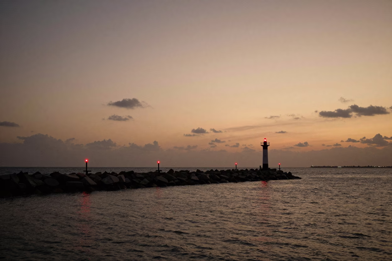 Twilight View of Miami Florida Breakwater Beacon Lights and Coastal Waterfront in in Miami, Florida, United States