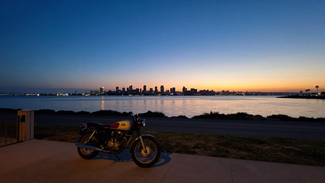 Twilight View of San Diego Bay and Coastline from Balboa Park with Vintage Motorcycle in in San Diego, California, United States