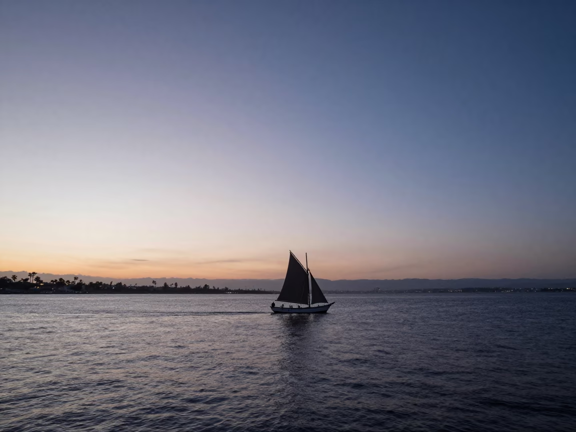 Twilight View of San Diego Bay with Dhow Silhouette and Lateen Sail at Sunset in in San Diego, California, United States
