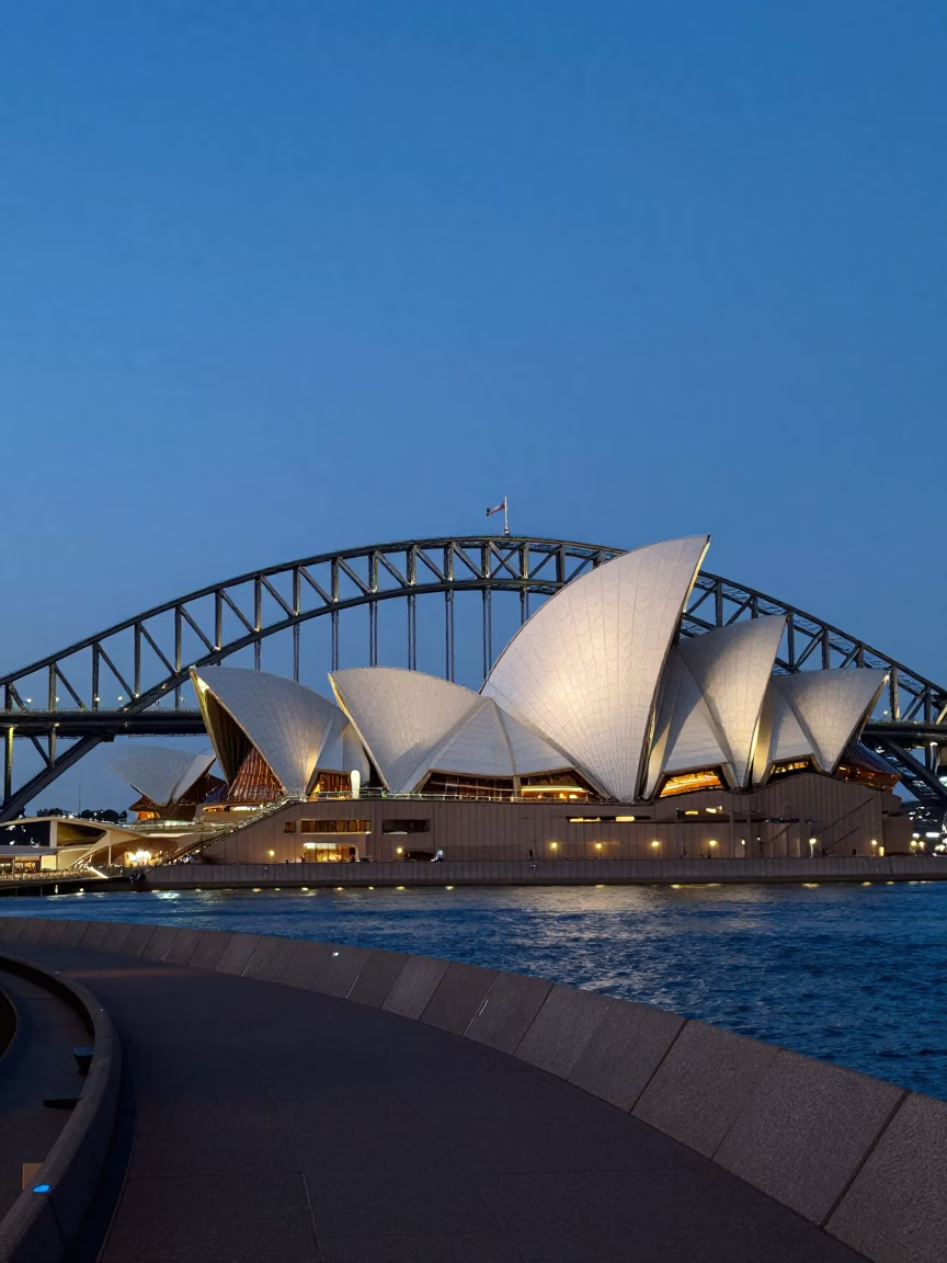 Twilight View of Sydney Harbour Bridge and Opera House with Pedestrian Walkway in in Sydney, New South Wales, Australia
