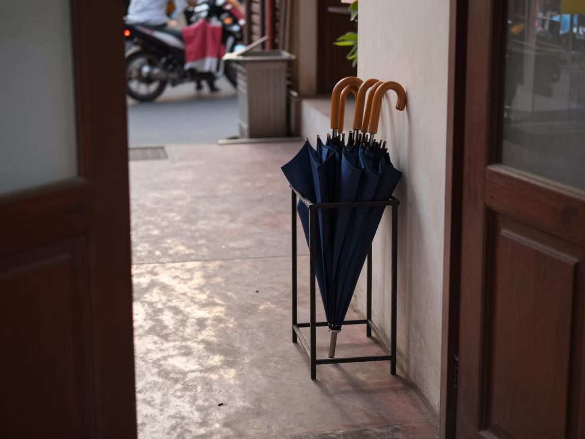 Umbrella Rack at Phnom Penh Guest Entrance Dawn in in a quiet guest corridor near Old Market, Phnom Penh