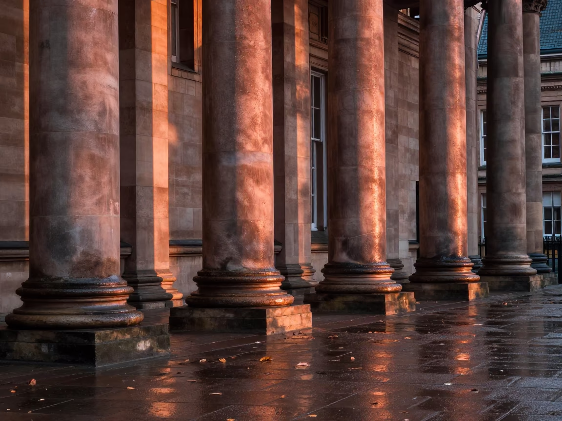 University of Liverpool Arcade Wet Leaves Skittering in Copper Dusk Light in in Liverpool, United Kingdom