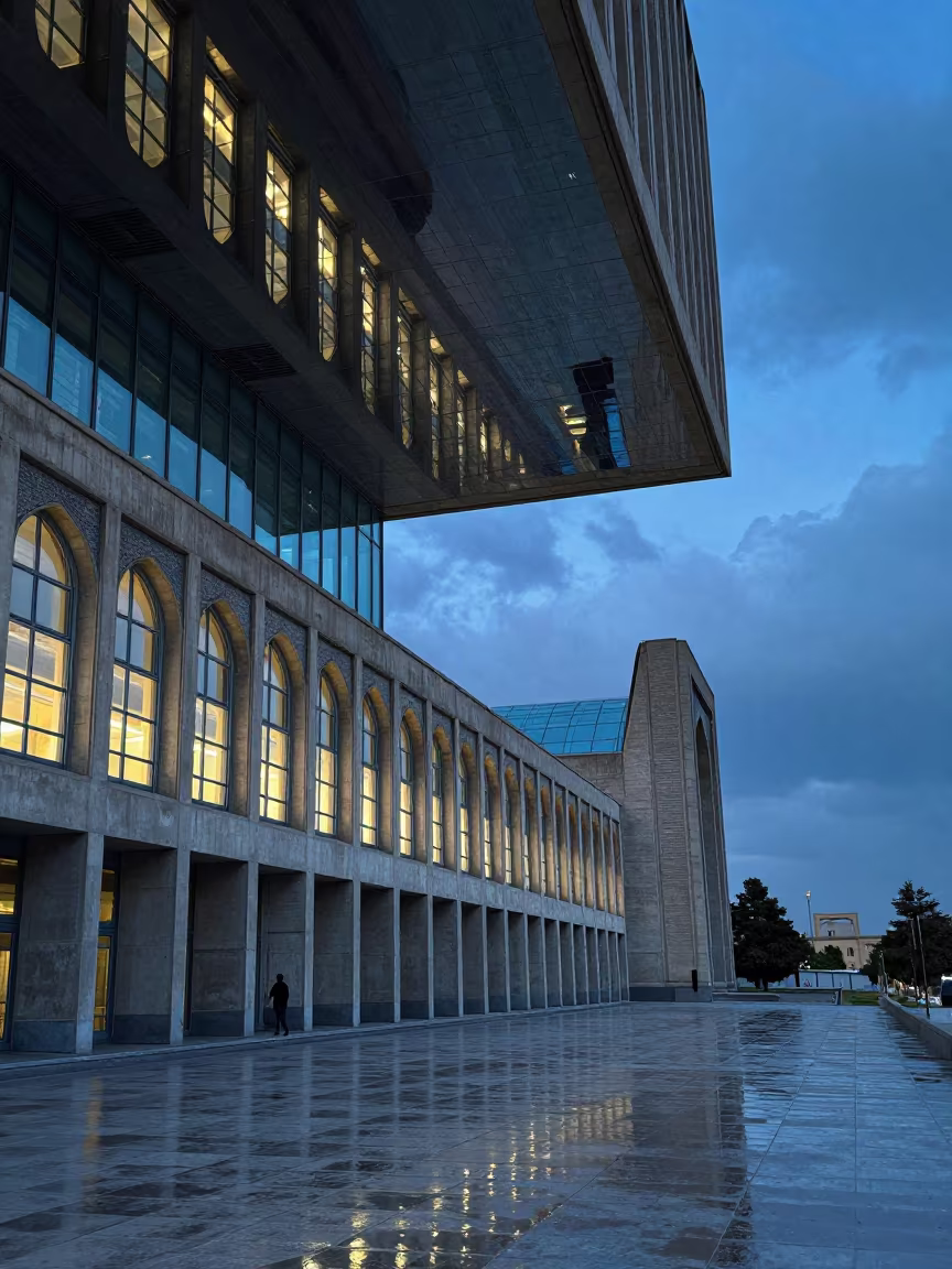 Upside-Down Brutalist Civic Center Reflected in Water Ceiling in inside a glass-roofed arcade near Shahrisabz