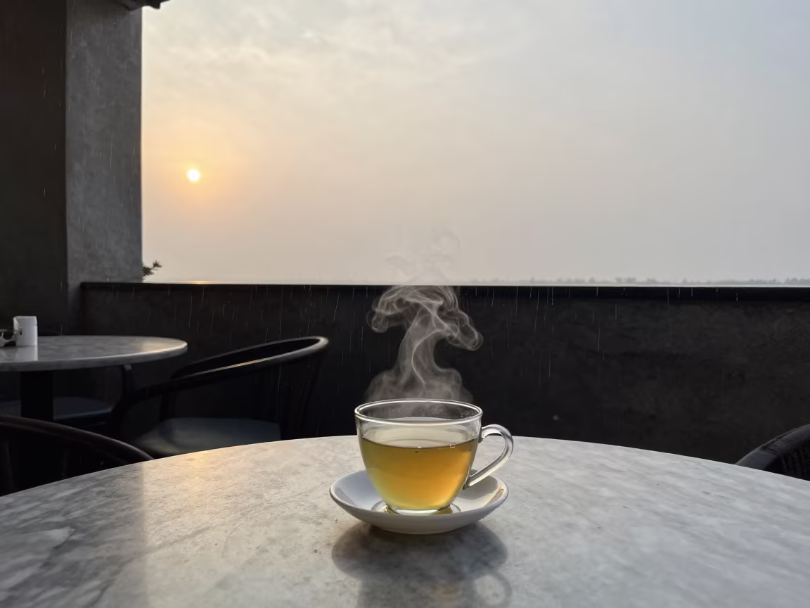 Upward Rain and Steaming Genmaicha in Prayagraj in on a marble cafe table in Prayagraj
