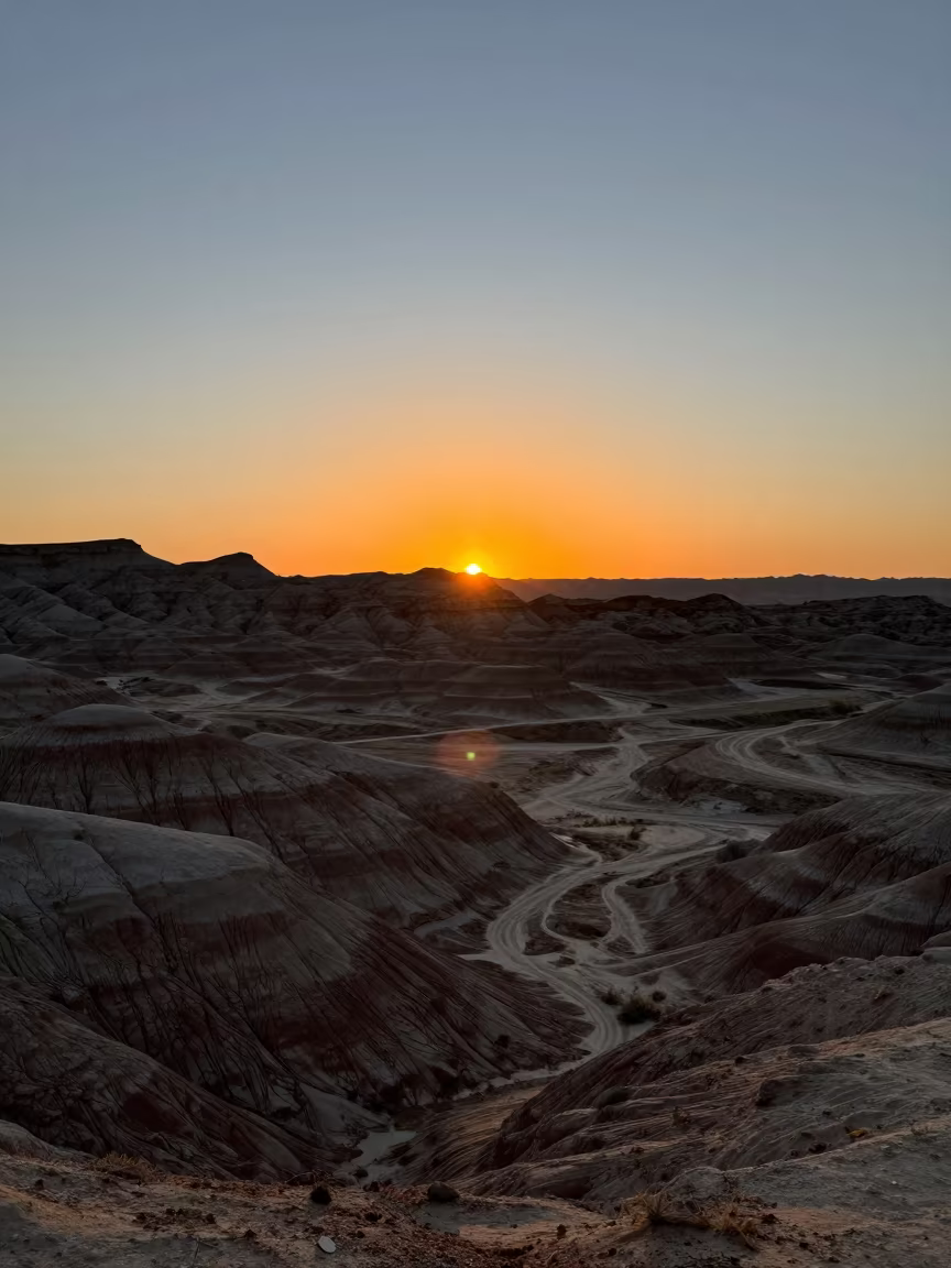 Utah Yardangs Silhouetted at Orange Sunset in in Utah