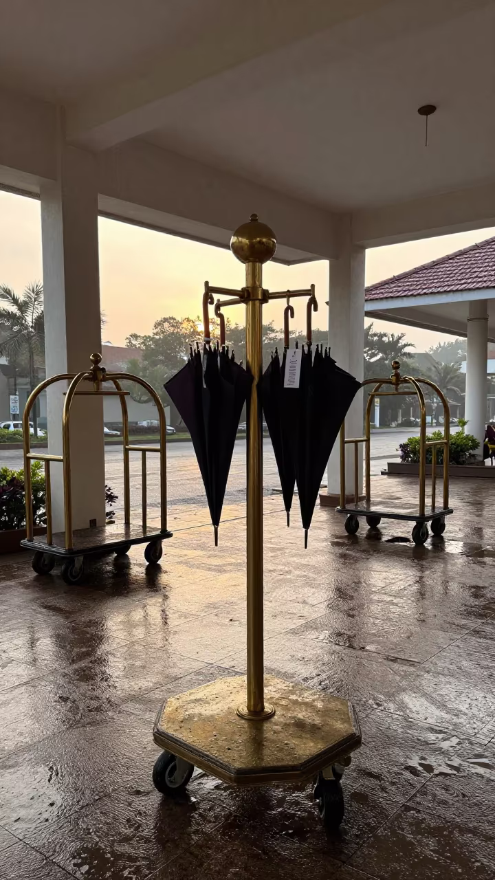 Valet Stand and Carts at Dawn in Abeokuta in at a porte cochere with brass luggage carts waiting in Abeokuta