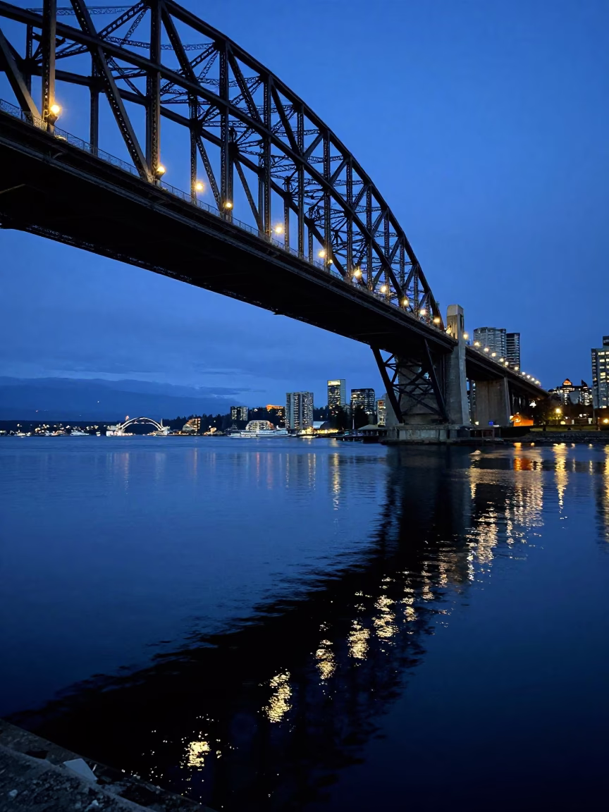 Vancouver Harbour Bridge Reflections in Twilight Blue Light Harbor Waters in in Vancouver, British Columbia, Canada