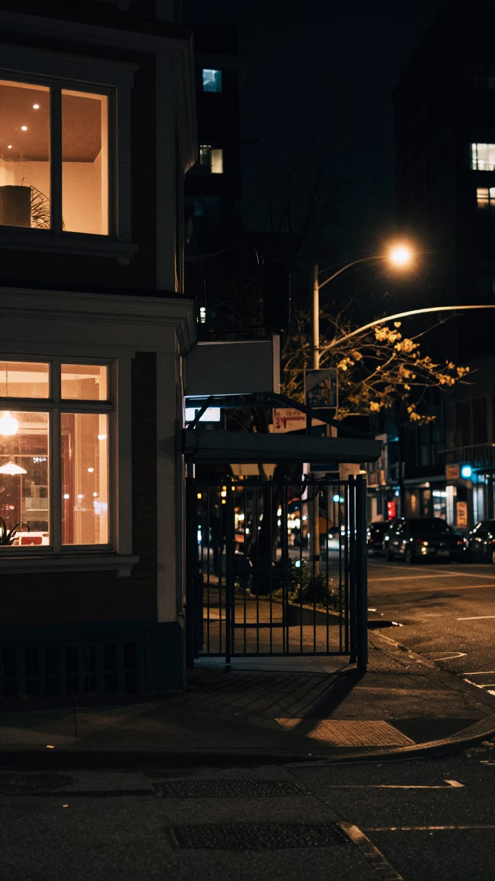 Vancouver Night Street Scene with Window Light and Gate Handle in in Vancouver, British Columbia, Canada