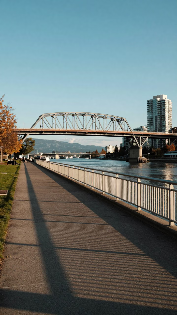 Vancouver Seawall Late Afternoon Light Steel Bridge and Urban Pathway Scene in in Vancouver, British Columbia, Canada