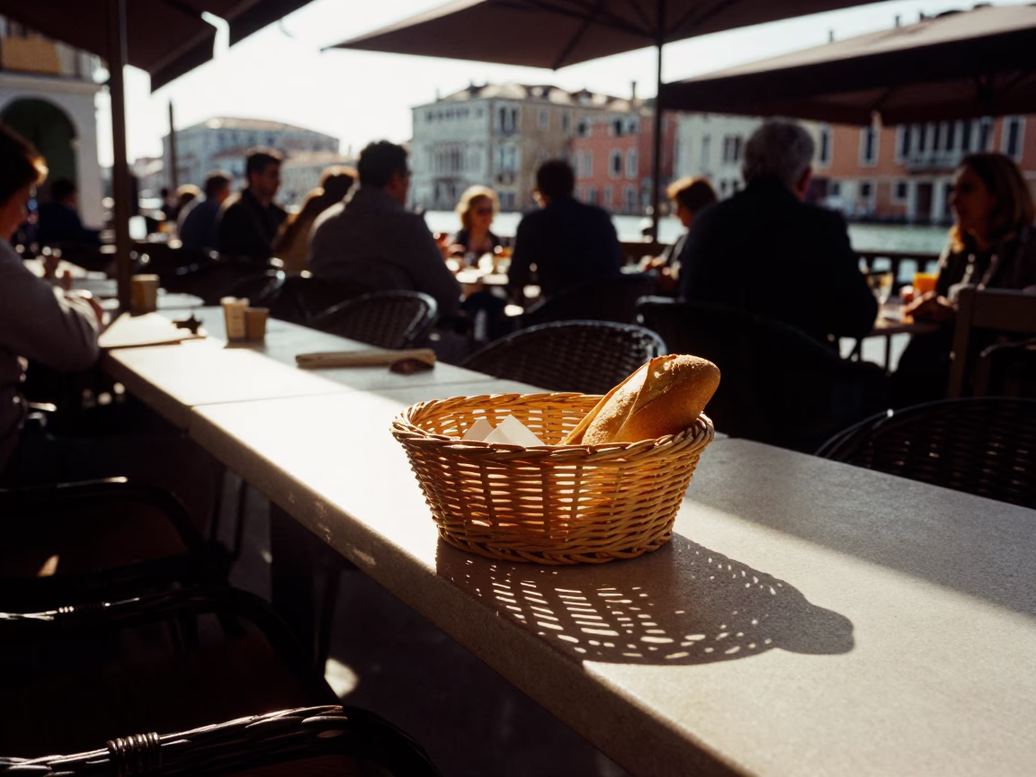 Venetian Café Terrace Morning Light with Wicker Shadow and Bread Basket in Venice Italy in in Venice, Italy